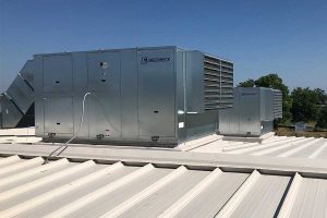Industrial HVAC system mounted on a metal roof.